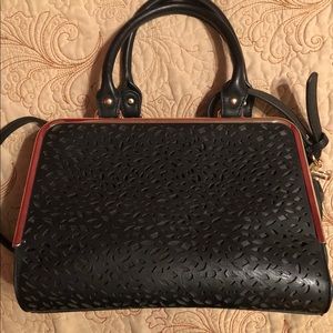 Cute black purse with cutout lacy front